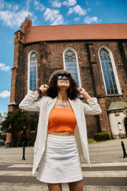 istock Beautiful young woman enjoying a sunny day in Europe while exploring historical architecture 2188010692