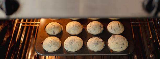 istock Freshly baked muffins in an oven. 2188011408