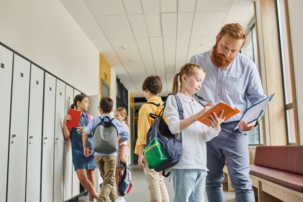 istock Engaging classroom moments with a dedicated teacher and attentive students in a modern school 2188015496