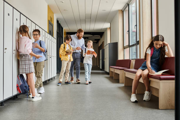 istock Engaging classroom interaction among teacher and students in a vibrant school hallway 2188015557