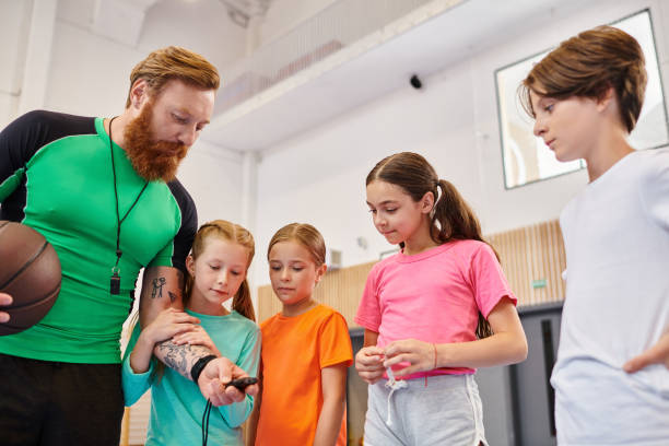istock Engaging moments between a teacher and students during a sport class in a modern classroom 2188015995