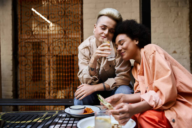 istock Young diverse couple enjoying a romantic date at a cozy cafe during a sunny afternoon 2188018169