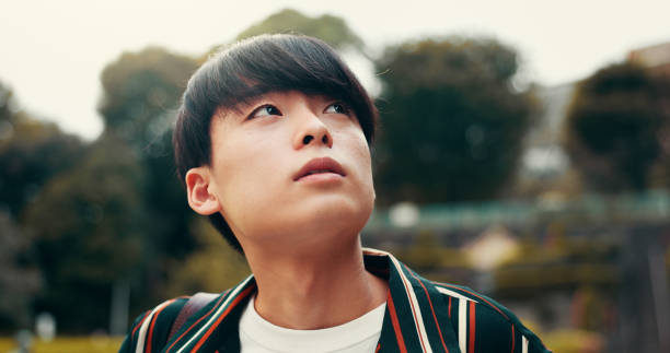 istock Man, thinking and employee commute in nature, contemplating future and sustainable development. Male person, ecology reflection and professional journey in Japan, travel and morning plan on trip 2188020497