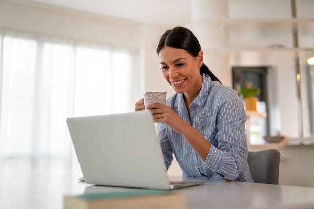 istock Happy young woman freelancer working on computer, studying online, shopping in internet store. 2188023196