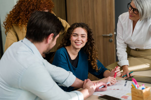 istock woman working with colleagues on project in the office 2188023755