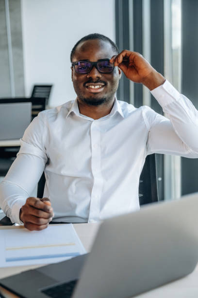 istock With laptop. Businessman is working in modern office 2188024419