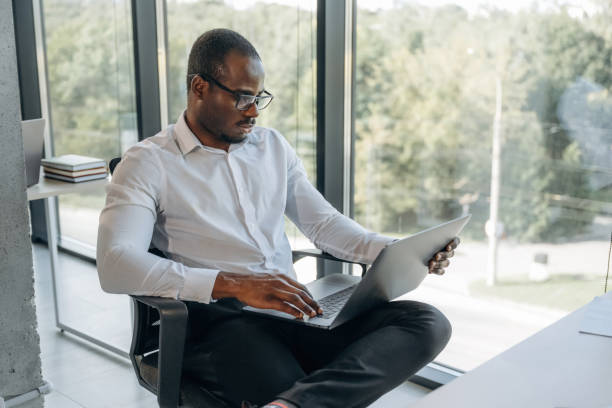 istock Using laptop. Businessman is working in modern office 2188024469
