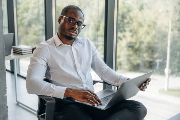 istock With laptop. Businessman is working in modern office 2188024472