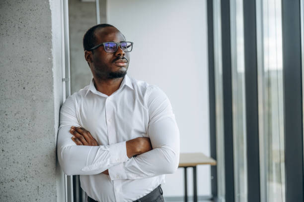 istock Standing with arms crossed. Businessman is working in modern office 2188024502