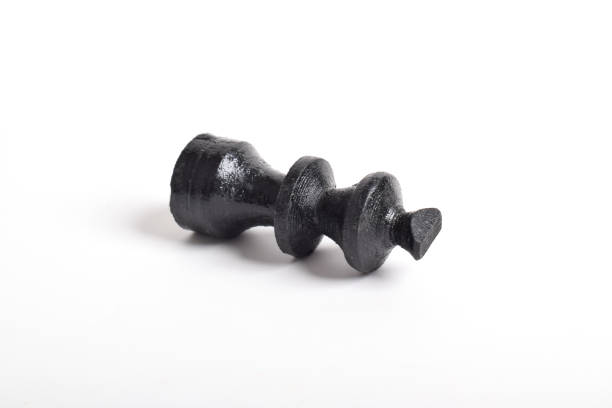 Black wooden chess king isolated on white background