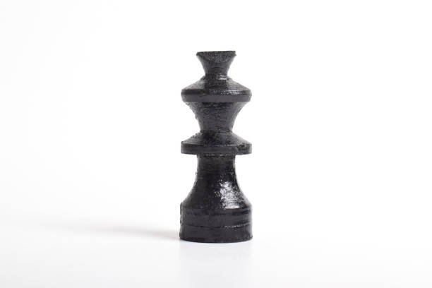 Black wooden chess king isolated on white background