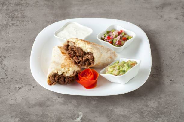 istock Beef burrito with salsa and guacamole. 2188028891