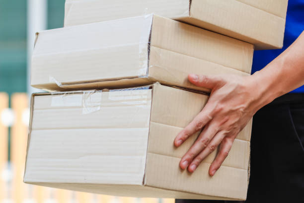 istock Delivery staff are checking products before sending them to customers by post. Checking products before shipping to ensure that products are complete according to order that customer has placed. 2188029486