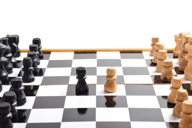 istock White chess pieces face off black chess pieces 2188030504