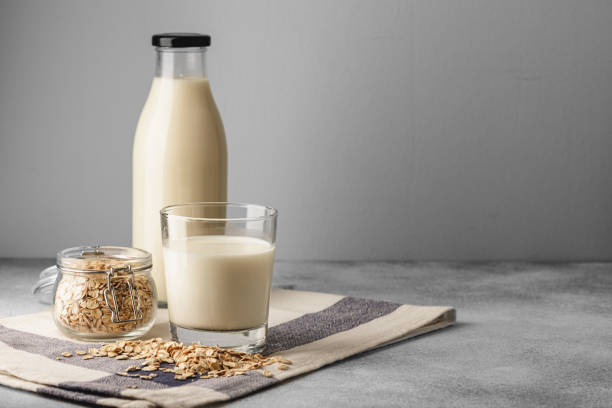 istock Vegan oat milk with oat flakes close up 2188031310