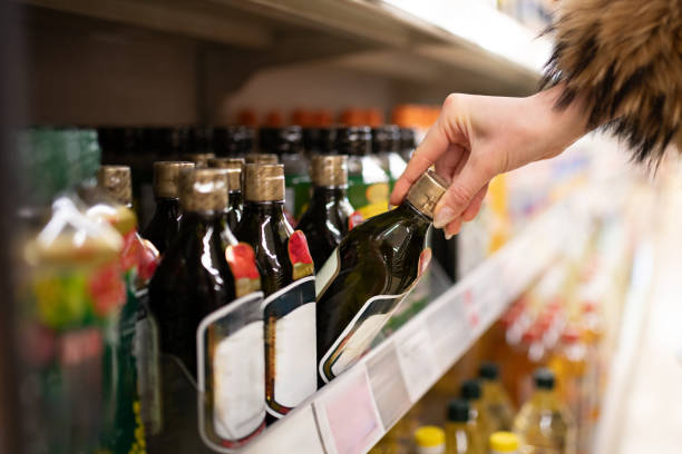 istock Woman's hands choosing olive oil 2188032637