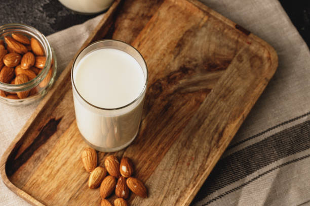 istock Almond milk with almond nuts in glass 2188033420