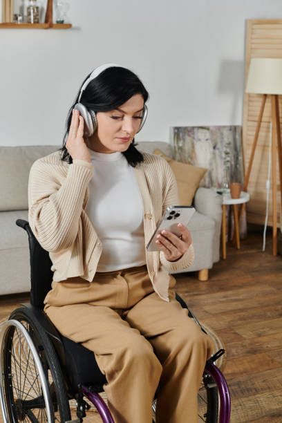 istock Empowered woman on wheelchair engaged in remote work from her cozy home setting 2188033970