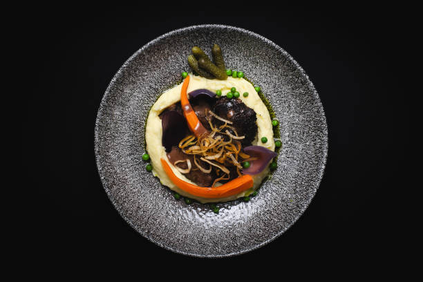istock Restaurant food serving, mashed potatoes with baked grilled vegetables on a black background. 2188034227