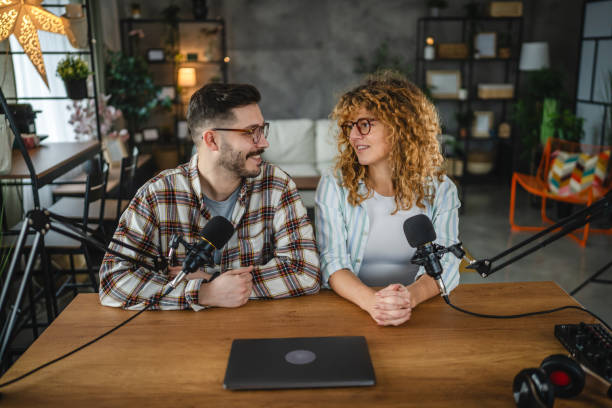 istock two radio hosts laugh and enjoy while record podcast in studio 2188034574