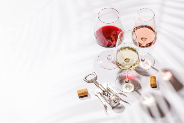 istock Three wine glasses filled with red, white, and rose wine 2188037159