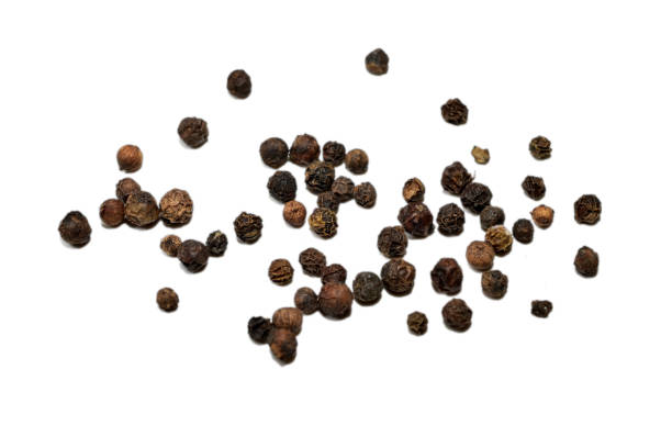 istock Black peppercorns are scattered across the table. 2188039998