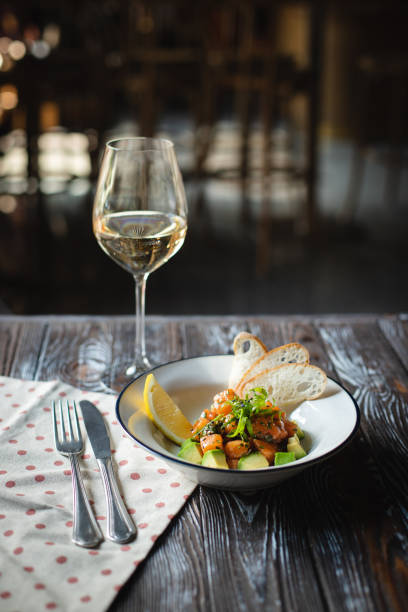 istock Salmon tartar with lemon, avocado and toast. 2188040129