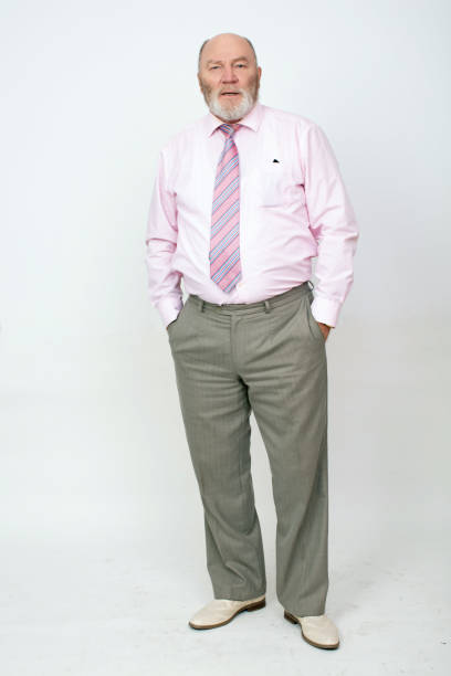 istock Confident mature businessman standing posed on white background 2188043863