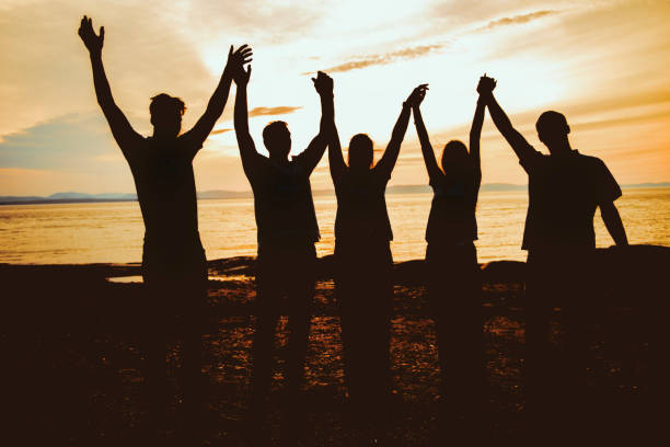 istock big family silhouette at beach on summer time 2188046259