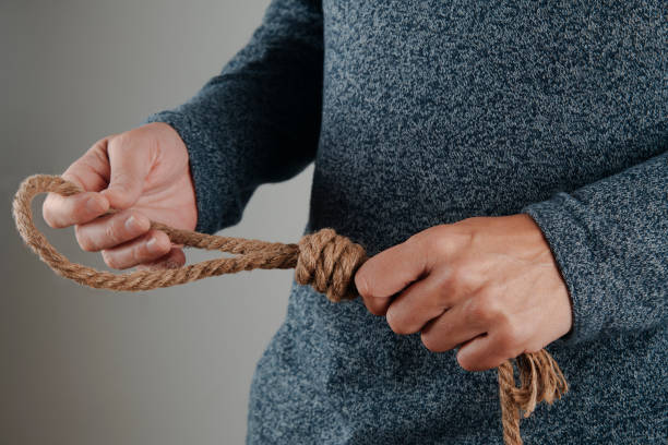 istock man holding a jute rope with a noose 2188047136