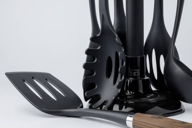 istock Stand with set of kitchen utensils on white background 2188047325