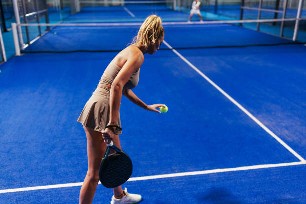 istock Female padel player in serve stance 2188049692