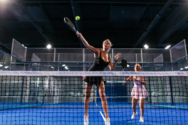 istock Two young women playing a doubles padel match 2188049703