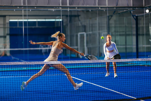 istock Dynamic doubles padel match on a blue court 2188049705