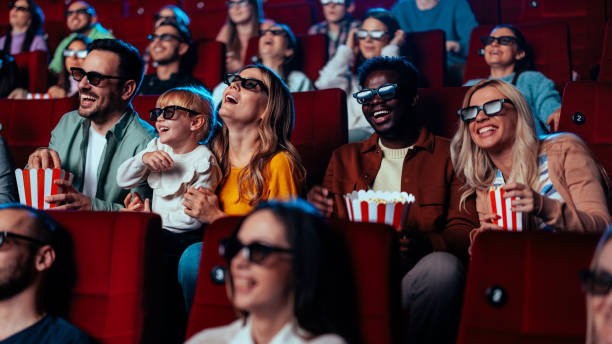 istock Joyful people watching 3D movie in cinema. 2188050352