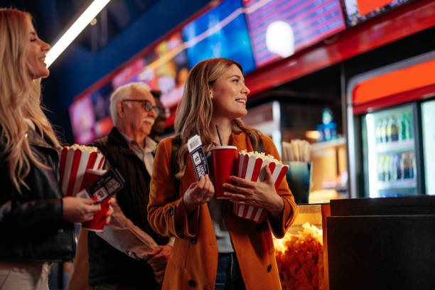 istock Diverse people in queue in movie theater. 2188050368