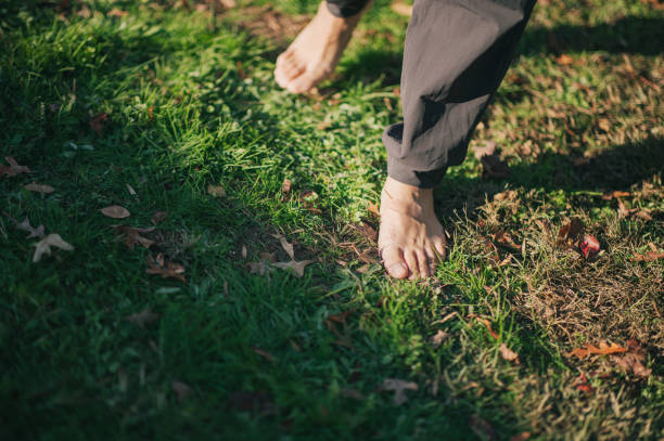 istock Barefoot on Grass - Grounding - Earthing - Filipino Man - Walking 2188051598