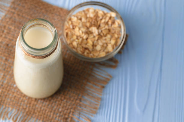 istock Vegan oat milk with oat flakes close up 2188053412