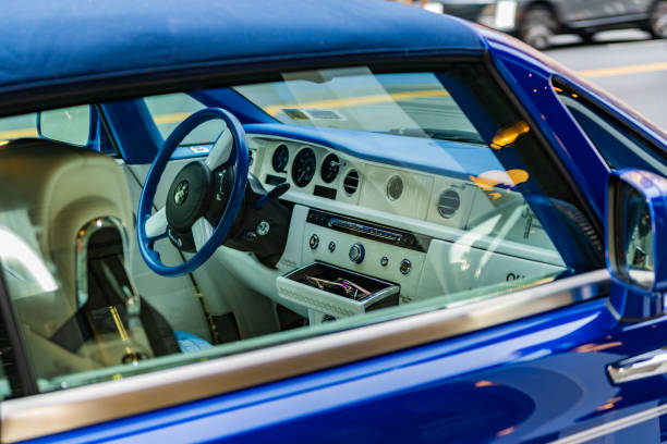 New York City, USA - July 7, 2023: 2008 Rolls-Royce Phantom Drophead Coupe blue car interior view from outside the passenger windows.