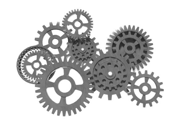 This 3D illustration depicts multiple interlocking steel gears against a dark background, symbolizing industrial strength, engineering precision, and mechanical processes. Perfect for visualizing industrial design, machinery, automation, and concepts related to engineering and teamwork