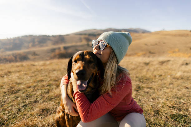 istock Woman with her dog taking a break from hiking 2188056070