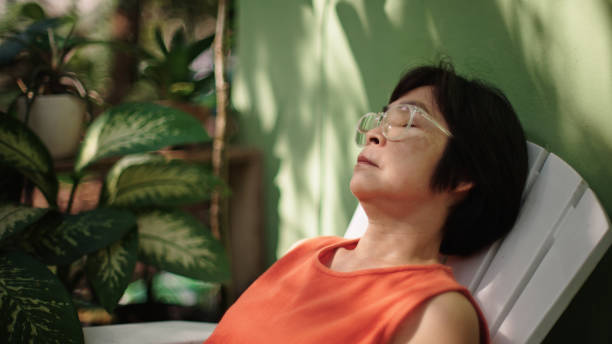 istock Mature woman resting at backyard. 2188058645