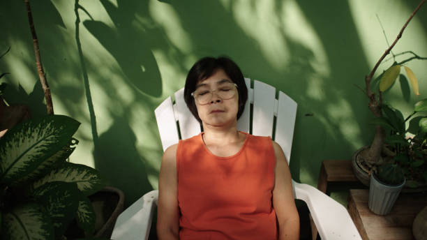 istock Mature woman resting at backyard. 2188058657
