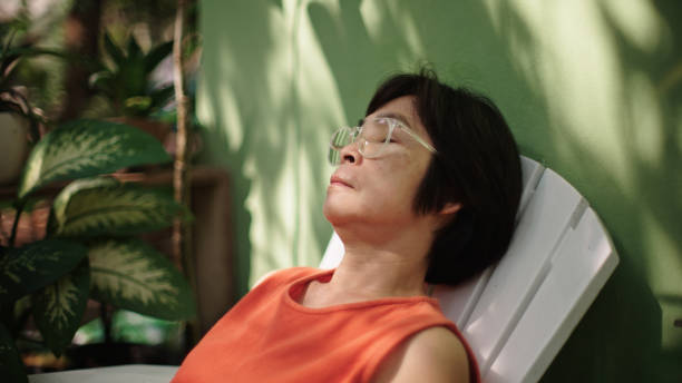 istock Mature woman resting at backyard. 2188058660