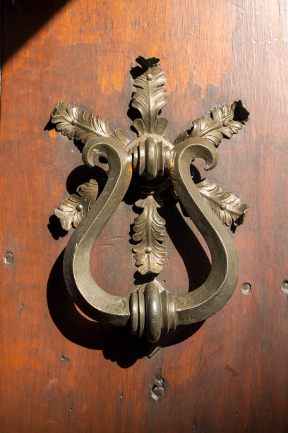 istock Ancient door handles in Rome 2188058878