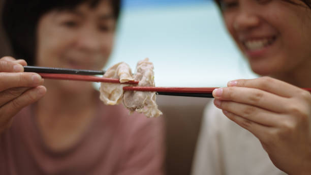 istock Mother and daughter enjoy celebrating at restaurant. 2188058922