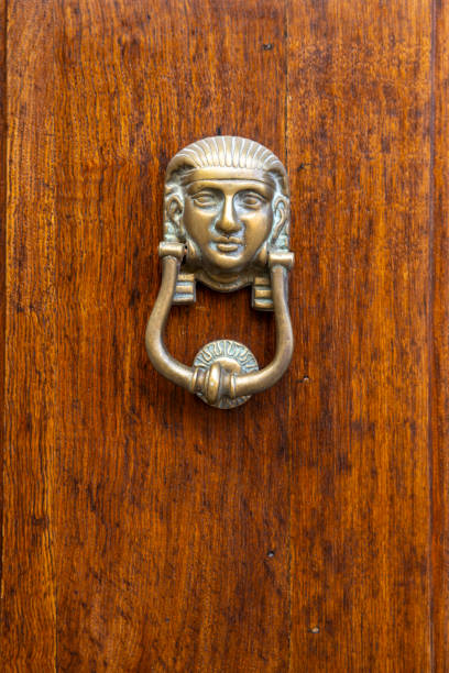 istock Ancient door handles in Rome 2188058994