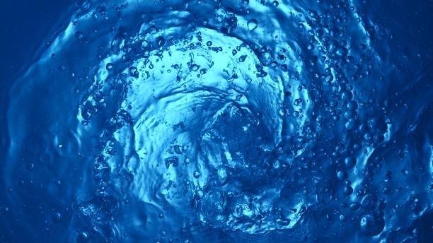 istock Texture of splashing water surface, top shot, tunnel shape. 2188059395