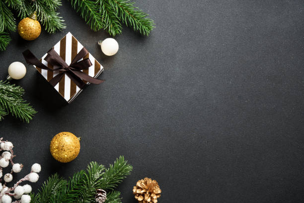 istock Black christmas background. Christmas flat lay with spruce tree and decorations. 2188061154
