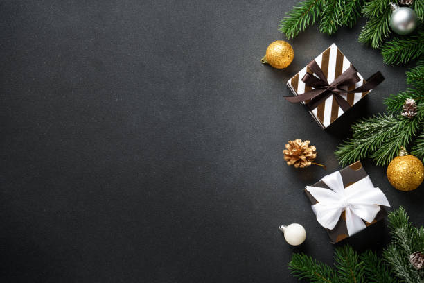 istock Black christmas background. Christmas flat lay with spruce tree and decorations. 2188061188